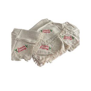 Set Of 4 Woven Holiday Napkins With "Seasons Greetings" Embroidery Fringe Edges